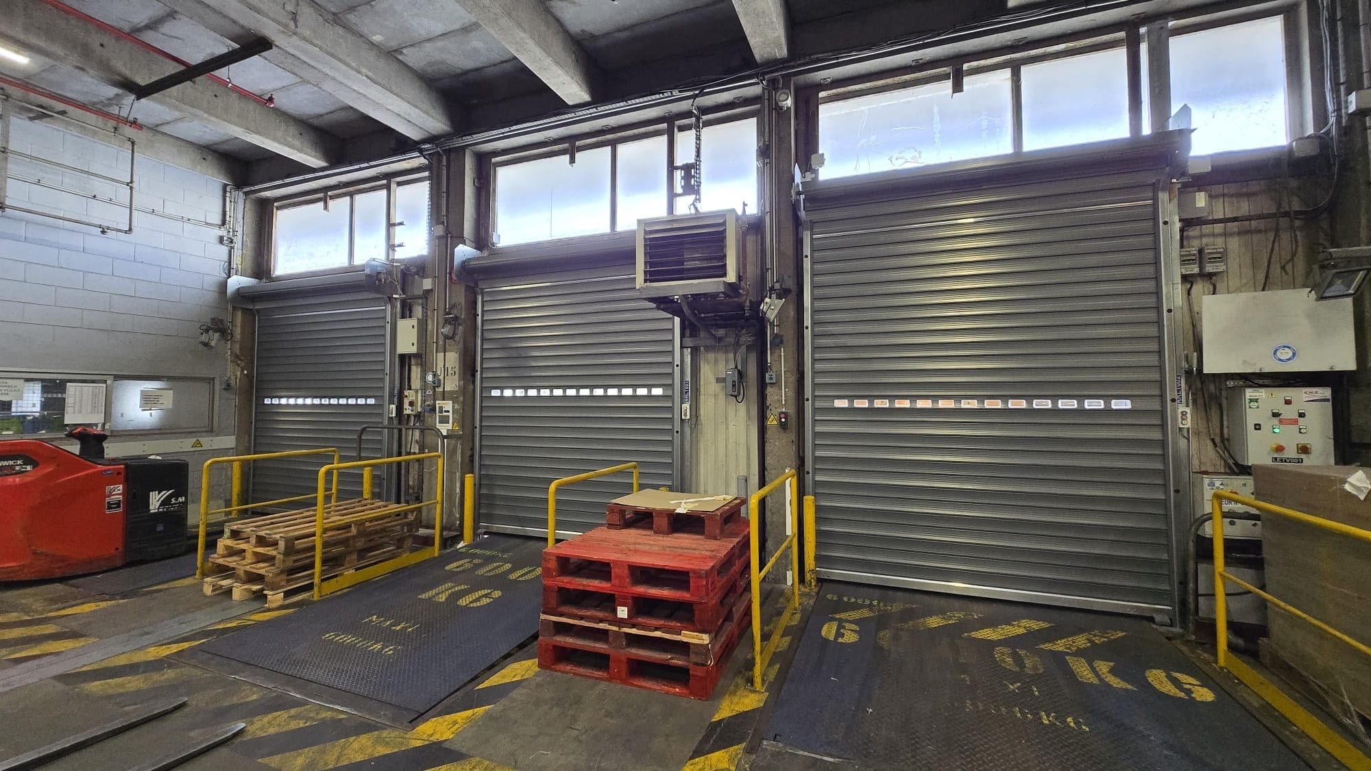 Remplacement de rideaux métalliques — Centre commercial